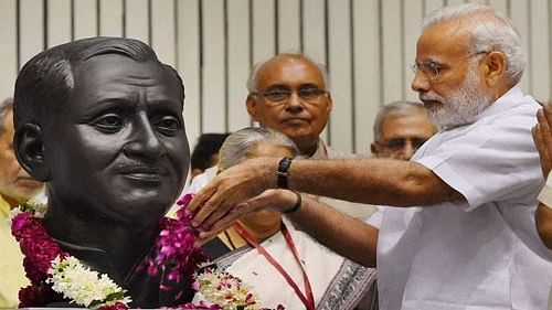 <div class="paragraphs"><p>File photo of Prime Minister Narendra Modi  paying tribute to Pandit Deendayal Upadhyaya.</p></div>