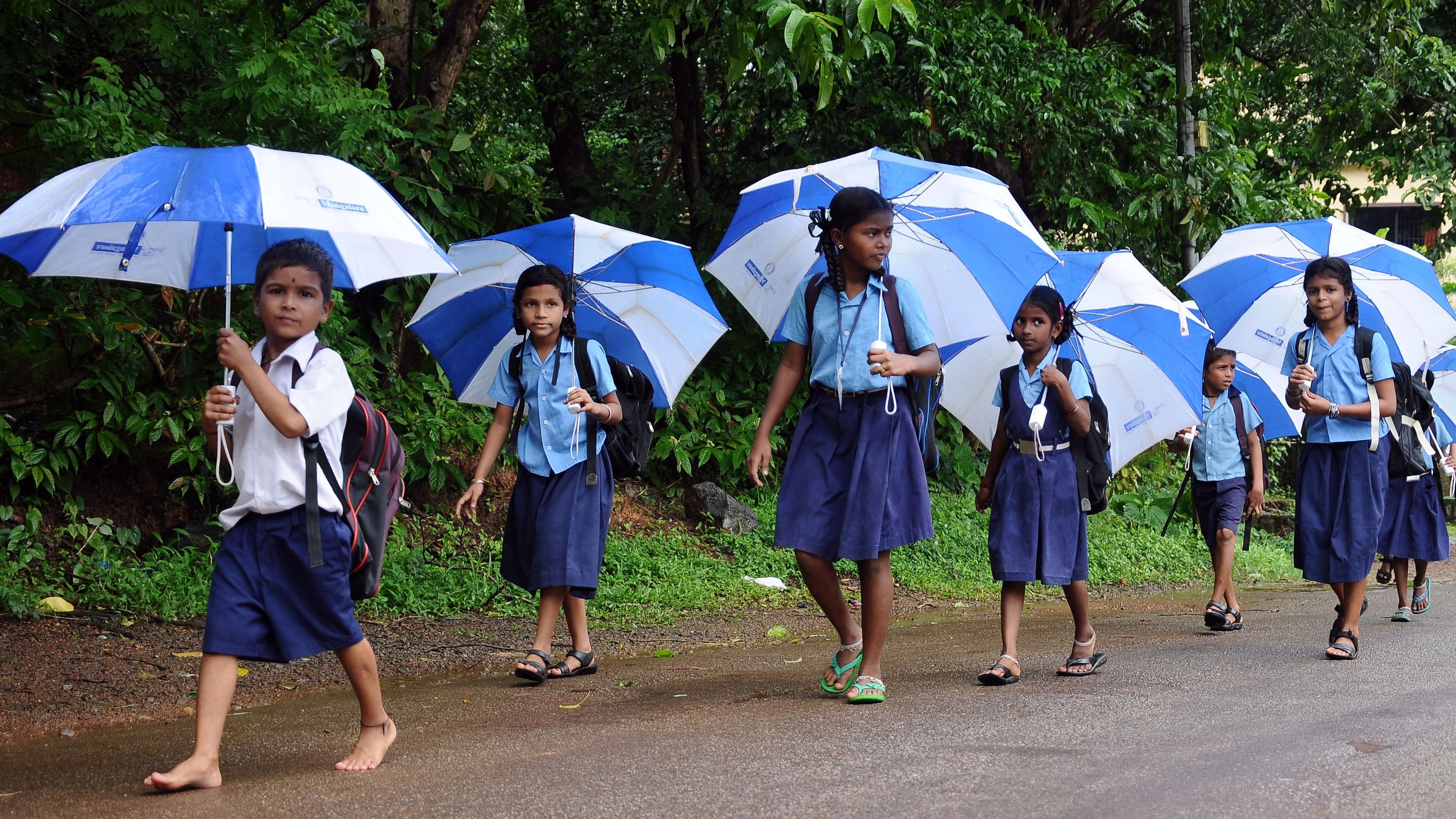 <div class="paragraphs"><p>Children walking to a government school that teaches Tulu.</p></div>