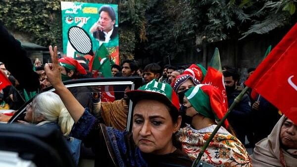 <div class="paragraphs"><p>Women supporters of former Prime Minister Imran Khan hold flags during a rally ahead of the general elections in Lahore, Pakistan.</p></div>