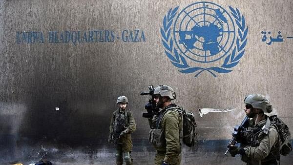 <div class="paragraphs"><p>Israeli soldiers operate next to the UNRWA headquarters, in the Gaza strip.</p></div>