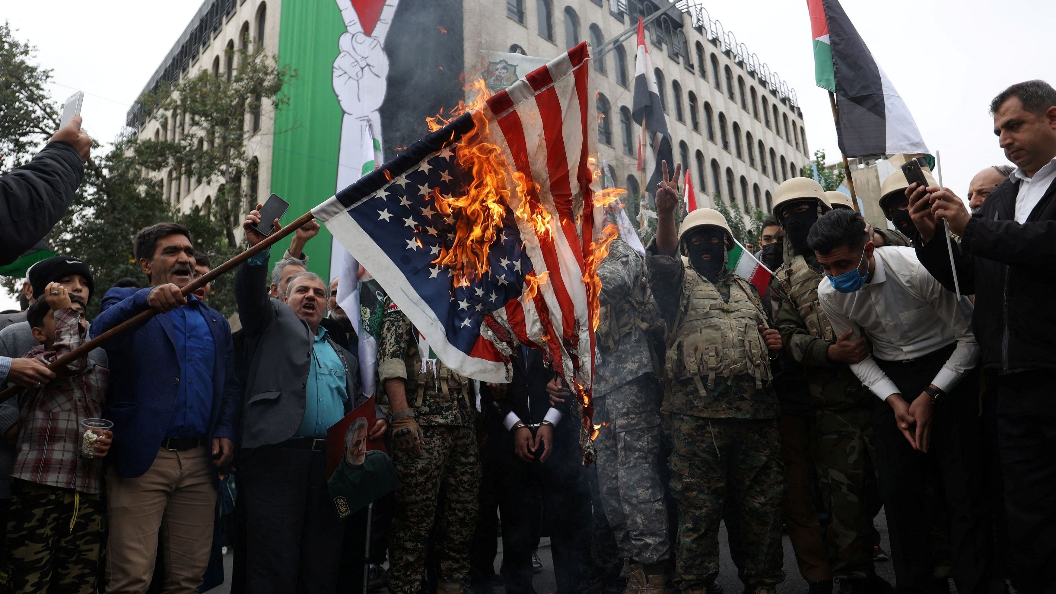 <div class="paragraphs"><p>Iranians burn the US flag during a rally in support of Palestinians, in Tehran, Iran.</p></div>