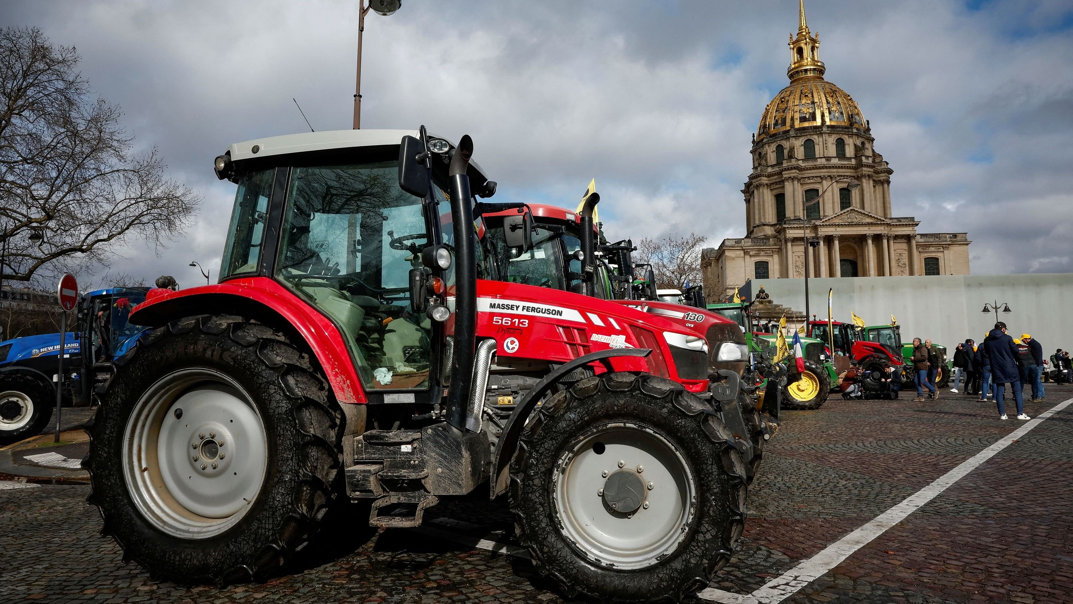 <div class="paragraphs"><p>Tractors of the French farmers of the Coordination Rural (CR) are parked during a go-slow operation as they protest ahead of the opening of the Paris farm show, in Paris, France, on Friday</p></div>