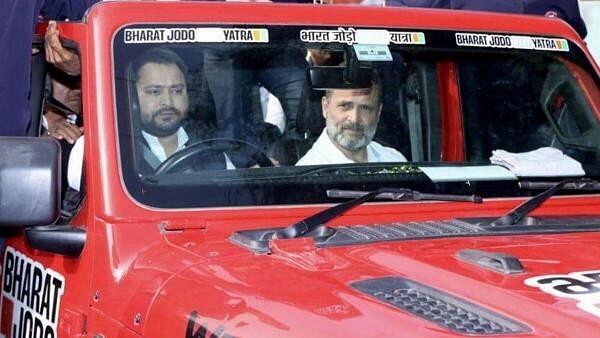 <div class="paragraphs"><p>JD leader and former deputy chief minister Tejaswi Yadav drives a car carrying Congress leader Rahul Gandhi during the 'Bharat Jodo Nyay Yatra', in Sasaram district of Bihar on Friday.</p></div>