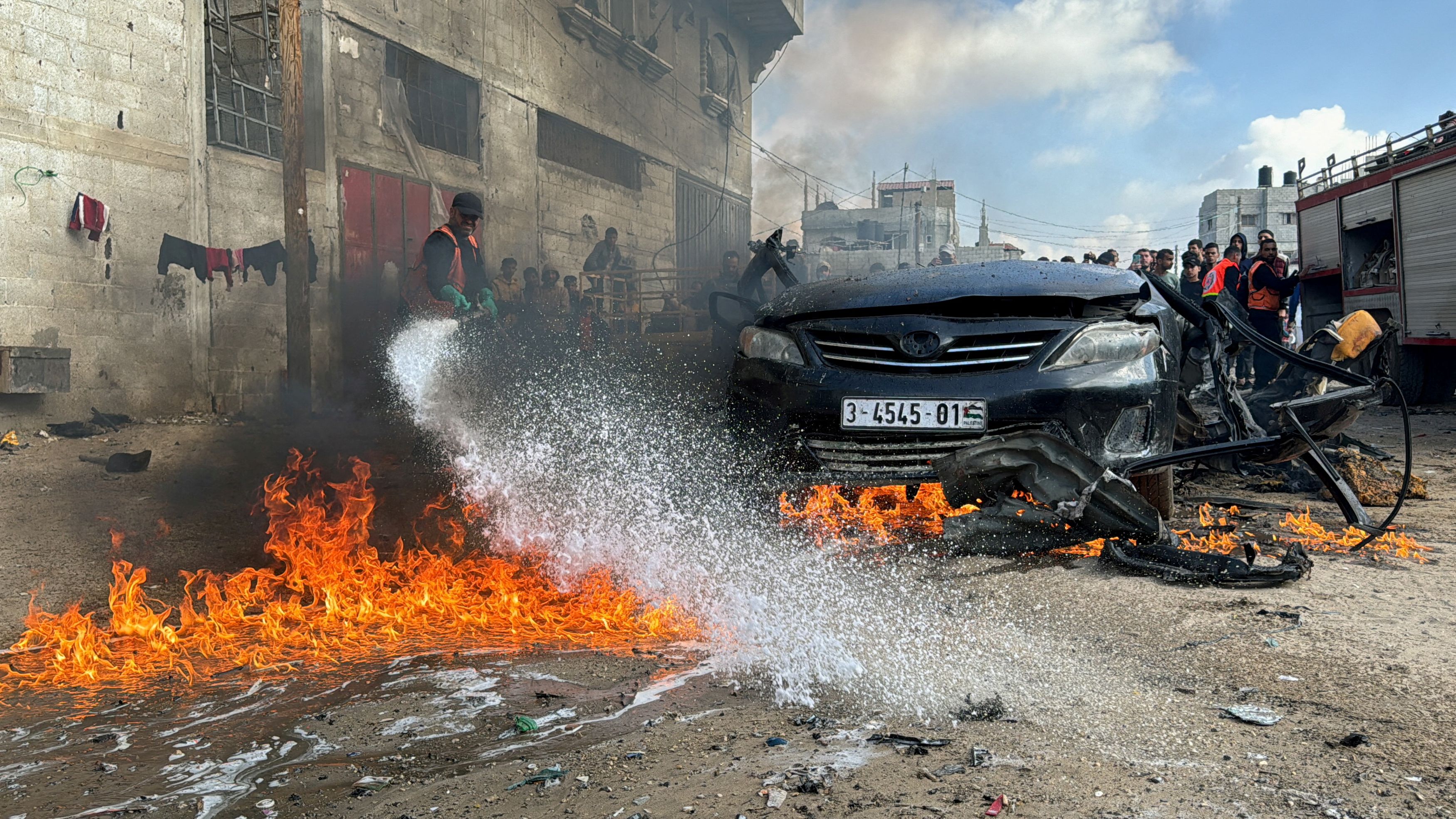 <div class="paragraphs"><p>A firefighter extinguishes a burning car hit by an Israeli strike, amid the ongoing conflict between Israel and Palestinian Islamist group Hamas, in Rafah in the southern Gaza Strip, February 10, 2024.</p></div>