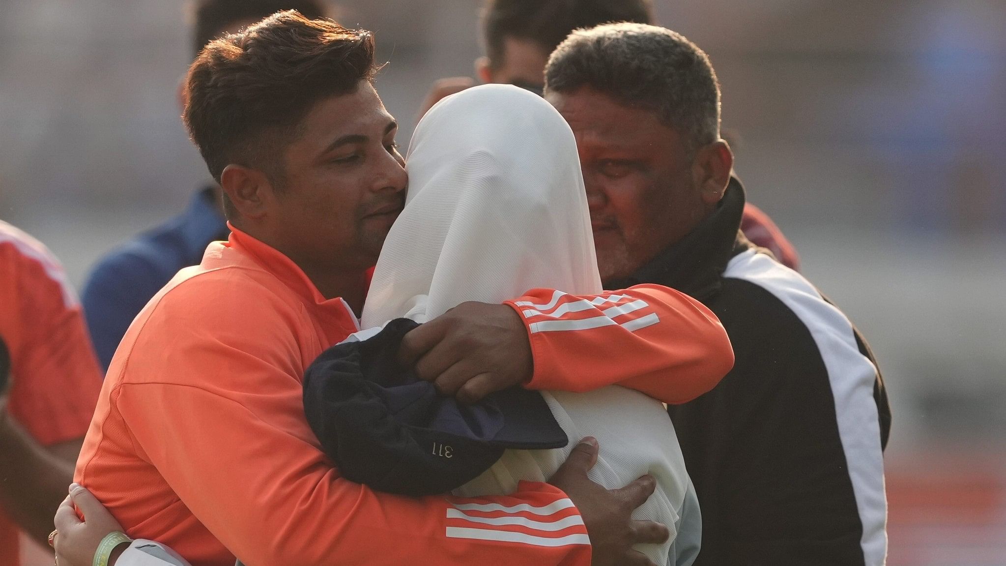 <div class="paragraphs"><p>Rajkot: India's Sarfaraz Khan hugs his mother after receiving his debut Test cap during the third cricket Test match between India and England, at Niranjan Shah Stadium, in Rajkot, Thursday, Feb. 15, 2024.</p></div>