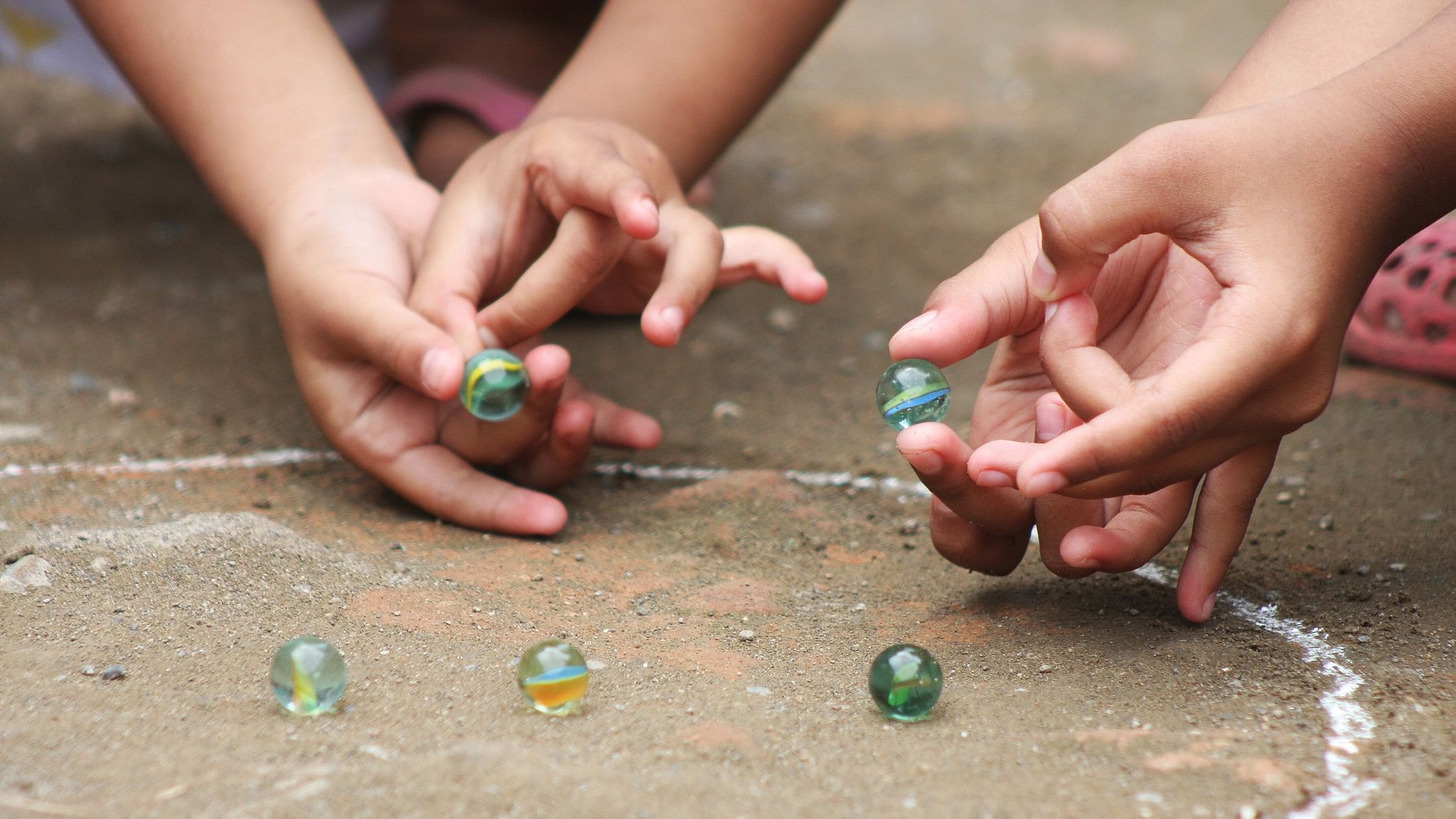 <div class="paragraphs"><p>Representative image of kids playing with marbles.</p></div>