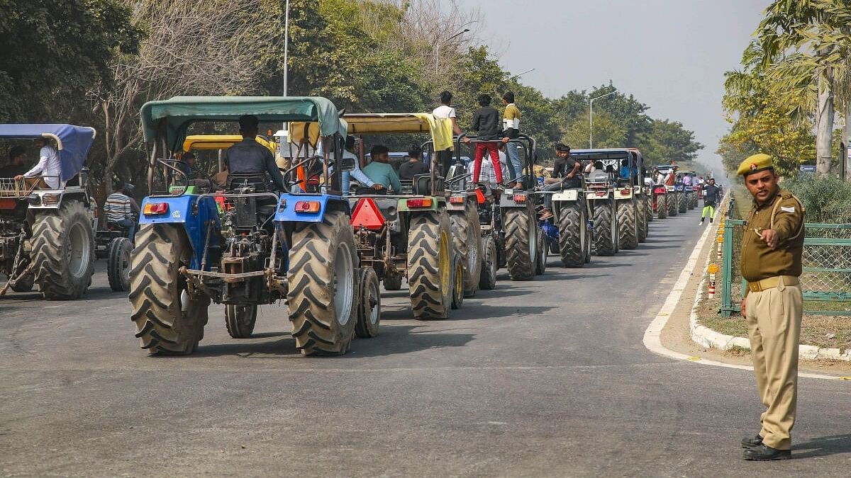 <div class="paragraphs"><p>Farmers take part in a tractor rally.</p></div>