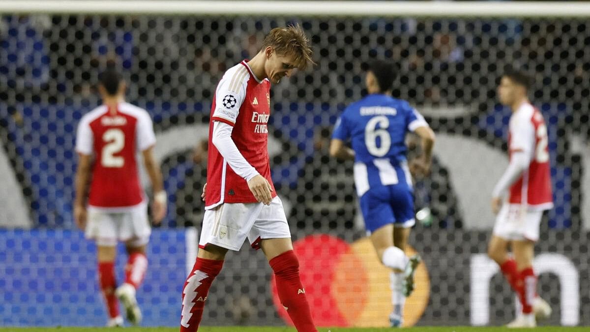 <div class="paragraphs"><p>Arsenal's Martin Odegaard looks dejected after FC Porto's Galeno scored their first goal.</p></div>