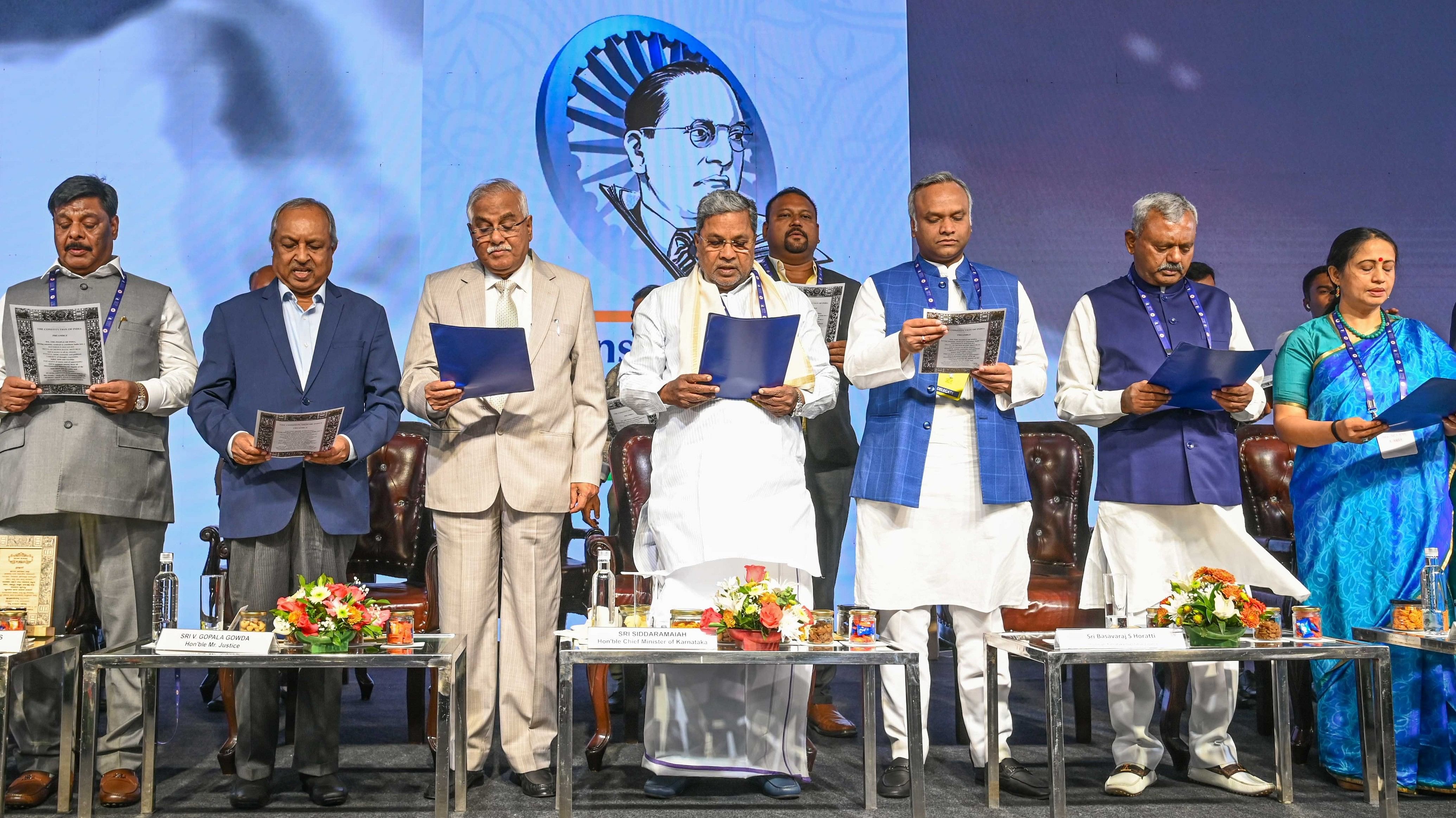 <div class="paragraphs"><p>Chief Minister Siddaramaiah reads the Preamble of the Constitution at ‘Constitution and National Unity’ convention in Bengaluru on Saturday. He is accompanied by Minister H C Mahadevappa, retired High Court judge Justice H N Nagmohan Das and former Supreme Court judge V Gopala Gowda, Minister Priyank Kharge, MLA S T Somashekar and additional chief secretary Shalini Rajneesh.&nbsp;</p></div>