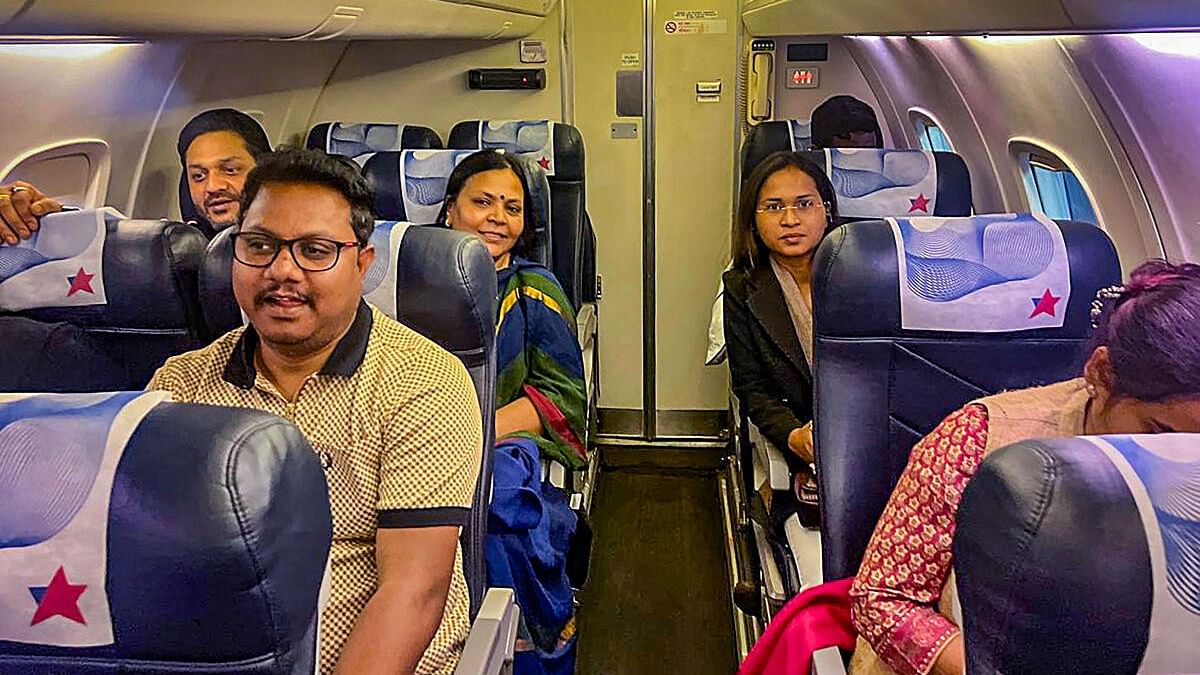 <div class="paragraphs"><p>MLAs of Jharkhand Mukti Morcha-led ruling alliance who were taken to Hyderabad, onboard a flight back to Ranchi, on Sunday, Feb. 4, 2024</p></div>