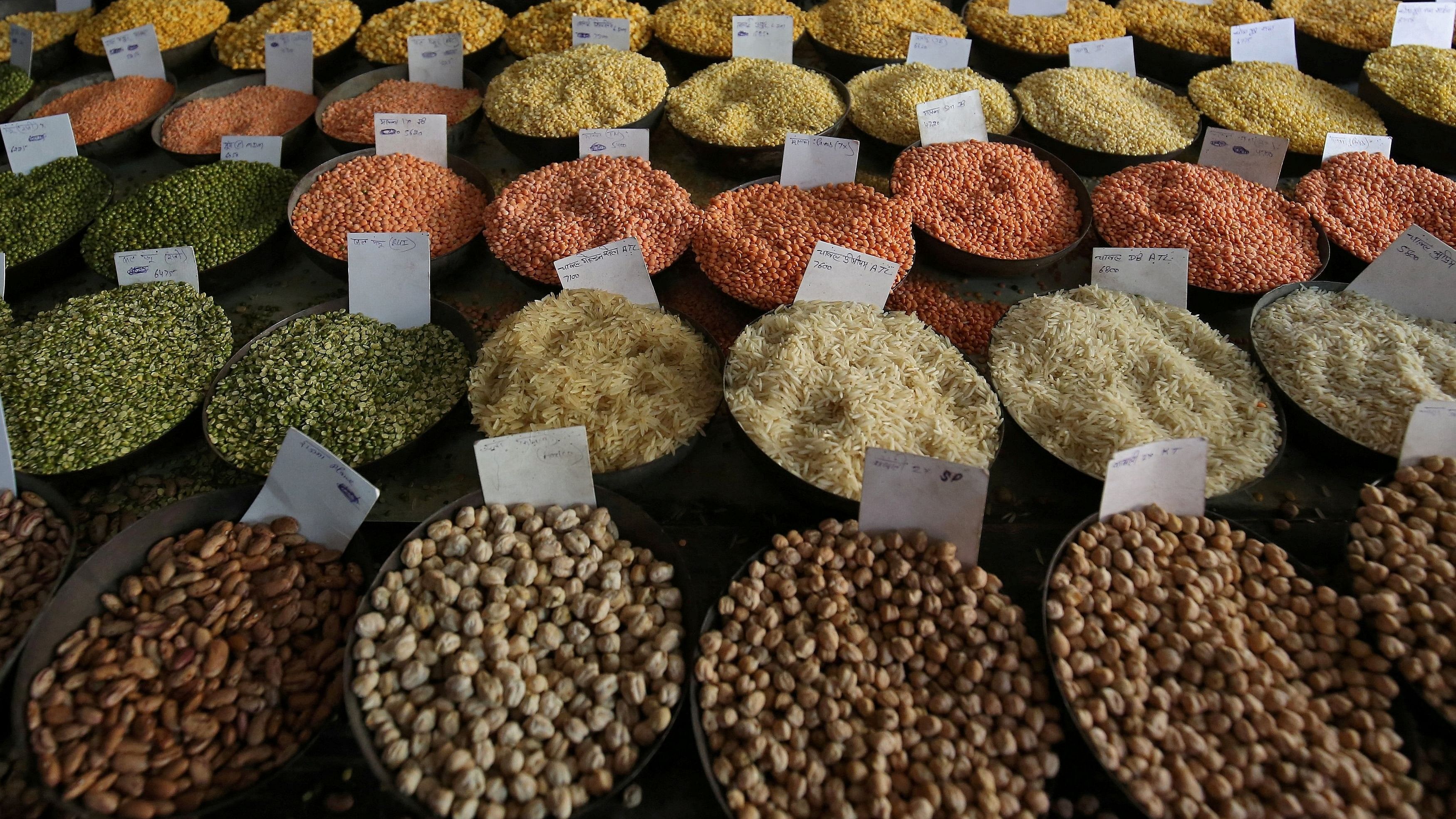 <div class="paragraphs"><p>Price tags are seen on the samples of rice and lentils that are kept on display for sale at a wholesale market in the old quarters of Delhi.</p></div>