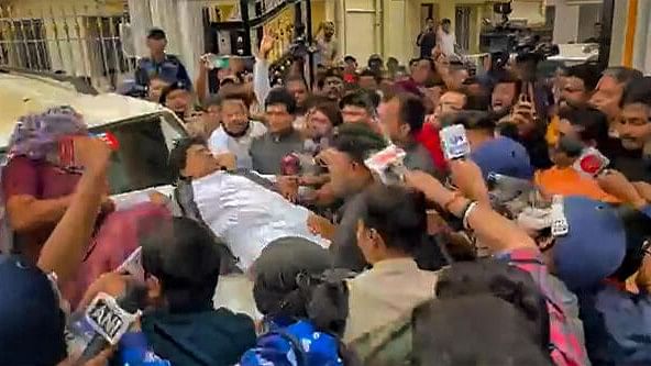 <div class="paragraphs"><p>West Bengal Bharatiya Janata Party (BJP) President Sukanta Majumdar falls on the bonnet of a car amid Sandeshkhali protest, in North 24 Parganas district, Wednesday, February. 14, 2024</p></div>