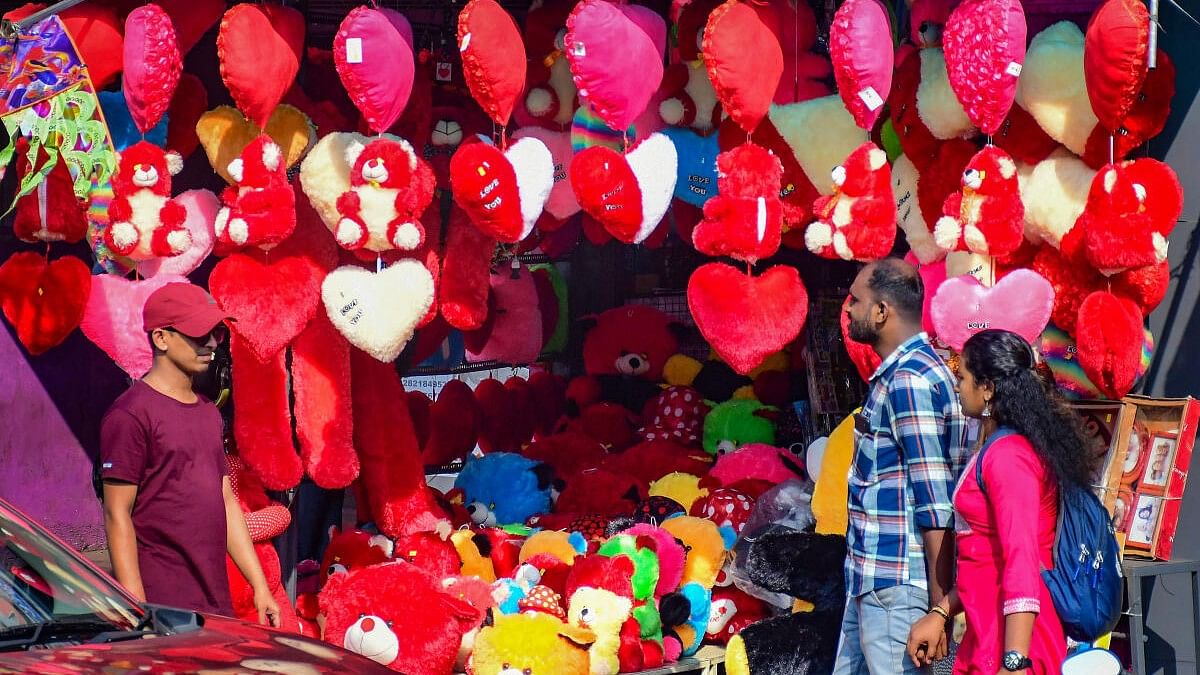 <div class="paragraphs"><p>People shop at a gift shop ahead of Valentine's Day, in Thiruvananthapuram.</p></div>