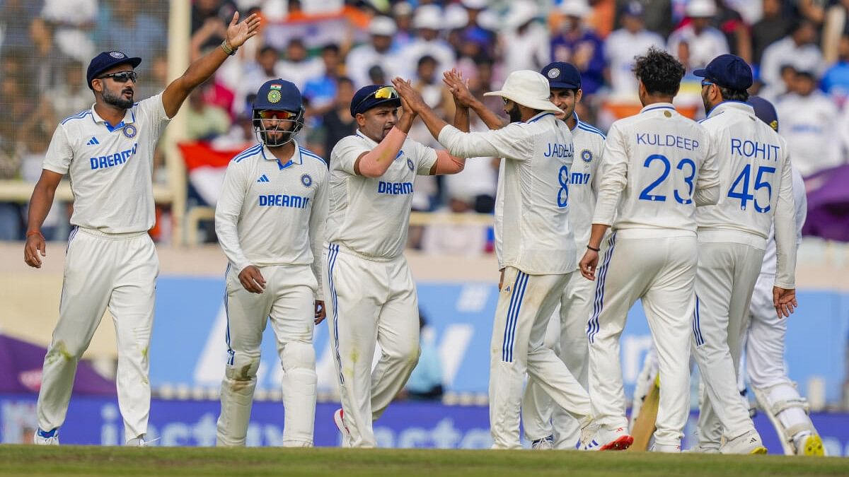 <div class="paragraphs"><p>Kuldeep Yadav celebrates with team-mates after dismissing England's Ollie Robinson during the third day of the fourth cricket Test at Ranchi.</p></div>