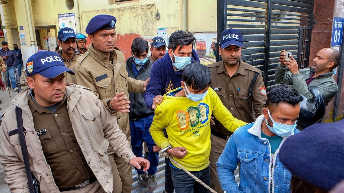 <div class="paragraphs"><p>People arrested on charges of taking part in violence that erupted after the demolition of an 'illegally built' madrasa being taken to a hospital for medical check-up, in Haldwani.</p></div>