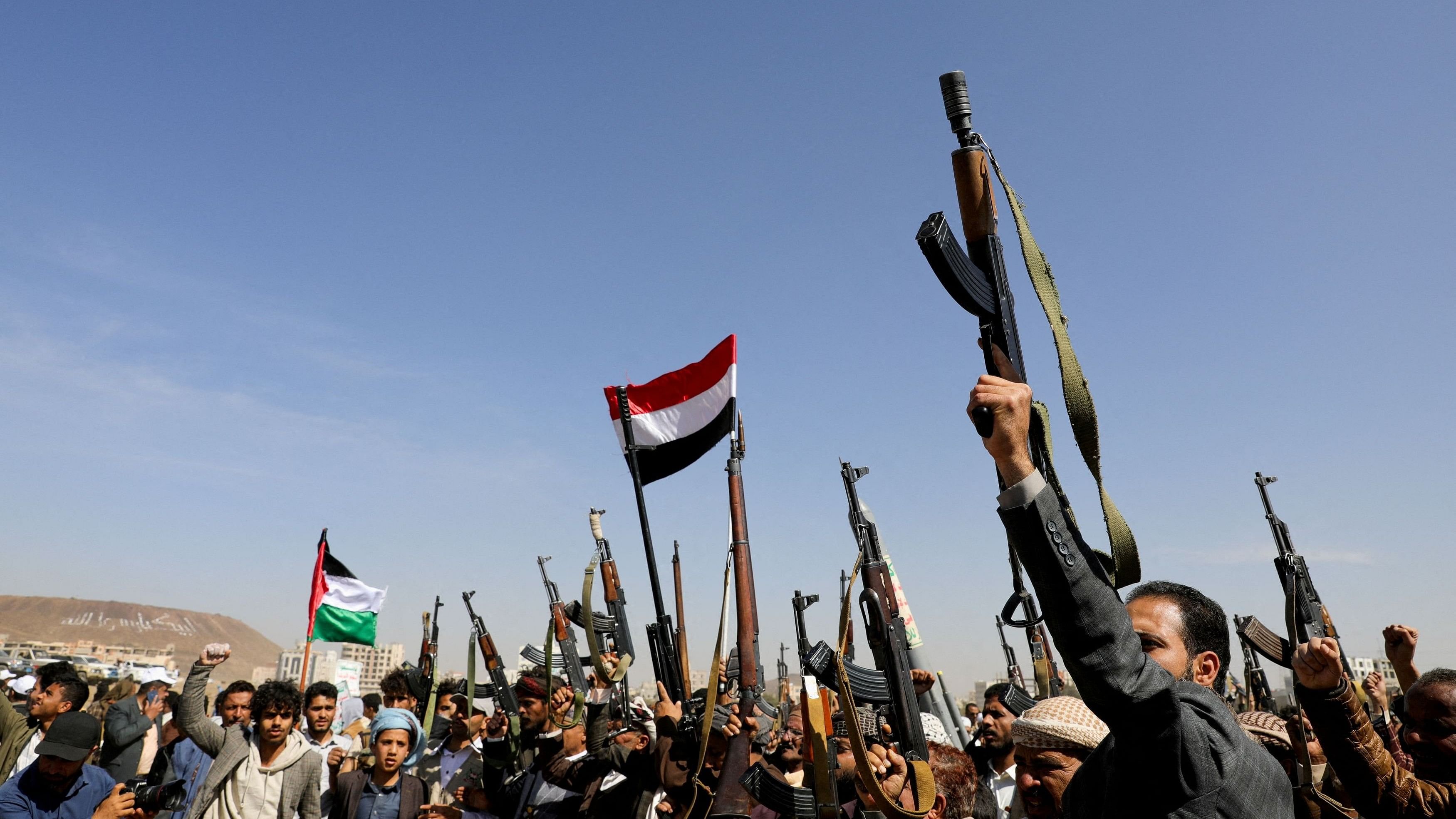 <div class="paragraphs"><p>Houthi followers raise firearms during a parade in solidarity with the Palestinians in the Gaza Strip, in Sanaa, Yemen, Jan 29, 2024.</p></div>