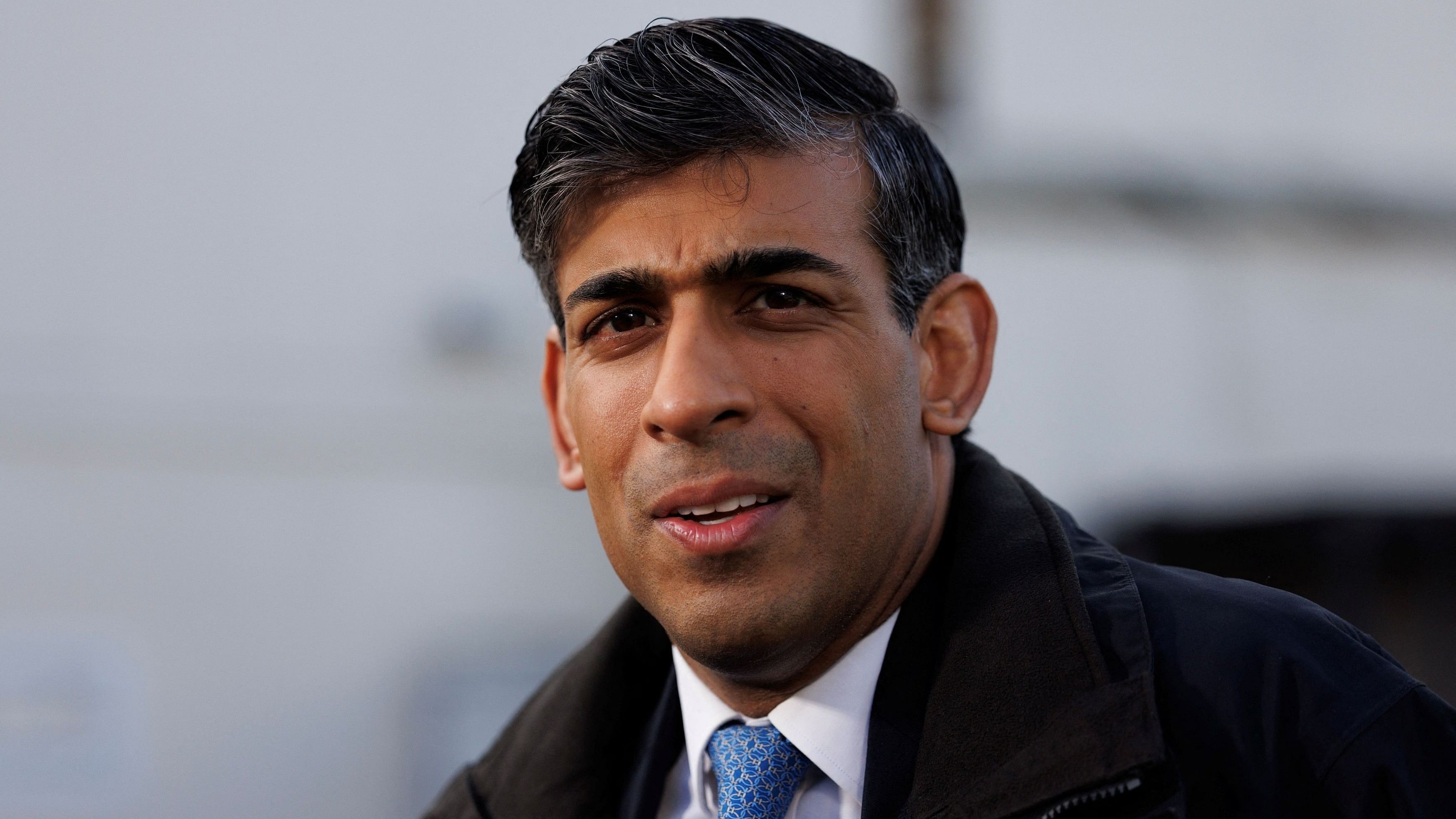 <div class="paragraphs"><p>British Prime Minister Rishi Sunak looks on while visiting a police station, in Harlow, Britain, February 16, 2024. </p></div>