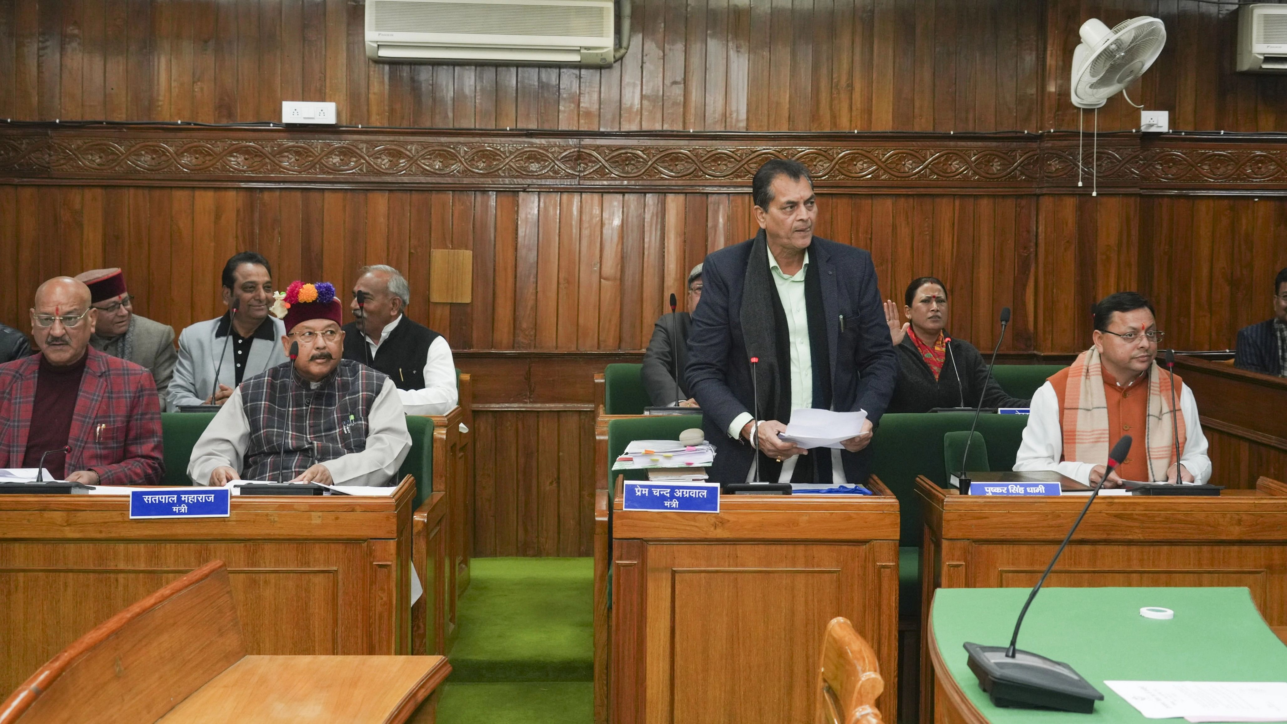 <div class="paragraphs"><p>Uttarakhand Chief Minister Pushkar Singh Dhami with the state Cabinet Ministers Prem Chand Aggarwal and Satpal Maharaj during the state Assembly session, at Vidhan Sabha Bhawan, in Dehradun, Tuesday, Feb. 6, 2024. The Uniform Civil Code bill, which proposes uniform marriage, divorce, land, property and inheritance laws for all citizens irrespective of their religion in Uttarakhand, was tabled in the state assembly on Tuesday. </p></div>