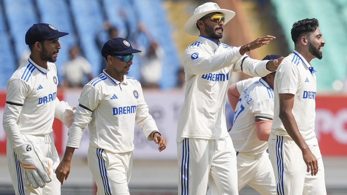 <div class="paragraphs"><p>India's Mohammed Siraj with team-mates celebrates the wicket of England's Ben Foakes during the 3rd day of the 3rd cricket test match between India and England, at Niranjan Shah Stadium, in Rajkot, Saturday, February 17, 2024.</p></div>