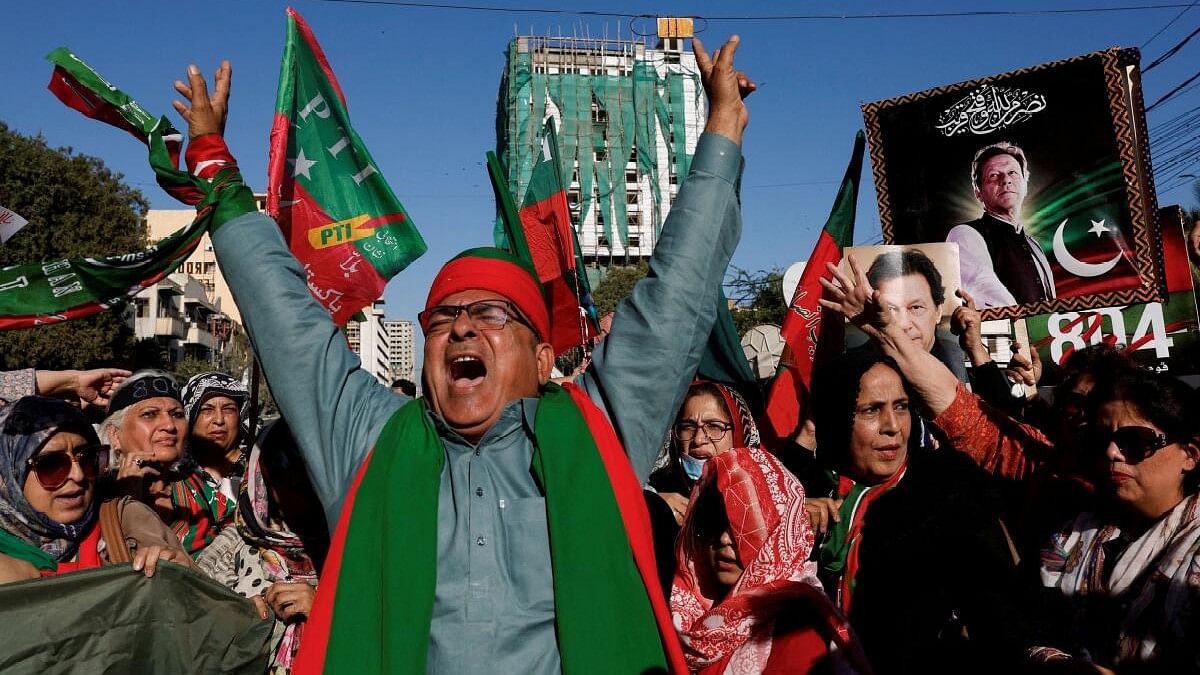 <div class="paragraphs"><p>Supporters of former Prime Minister Imran Khan's party, the Pakistan Tehreek-e-Insaf (PTI), chant slogans as they gather during a protest demanding free and fair results of the elections in Karachi.&nbsp;</p></div>