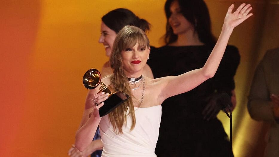 <div class="paragraphs"><p>Taylor Swift accepts the award for Album of the Year for Midnights during the 66th Annual Grammy Awards in Los Angeles.</p></div>