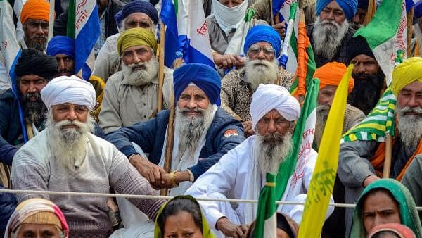 <div class="paragraphs"><p>Farmers listen to their leaders at the Punjab-Haryana Shambhu border during their 'Delhi Chalo' protest, near Patiala district, Sunday, Feb. 18, 2024.</p></div>