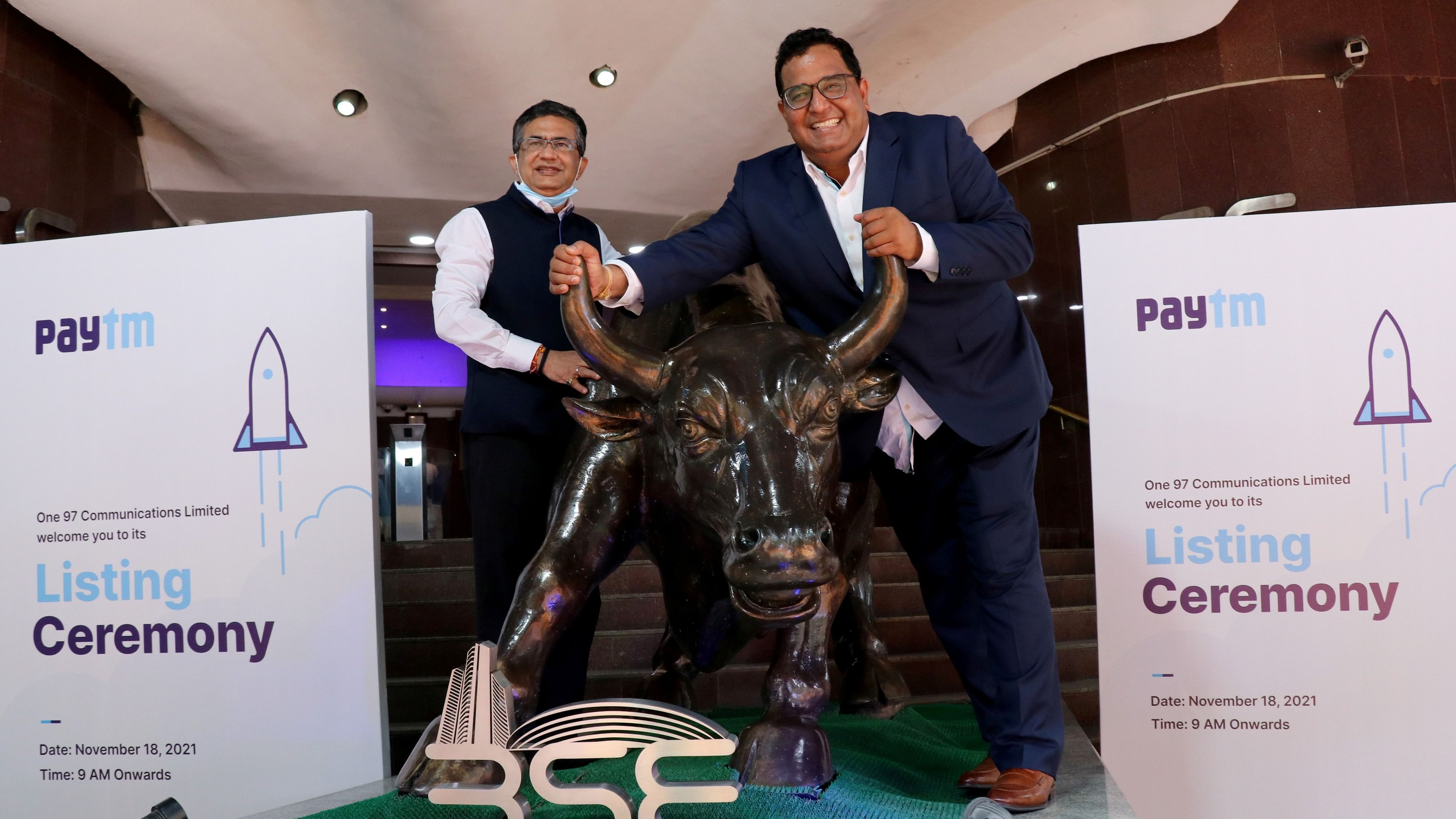 <div class="paragraphs"><p>A file photo of&nbsp;Paytm founder and CEO Vijay Shekhar Sharma posing&nbsp;with a bronze replica of a bull at the BSE in Mumbai</p></div>