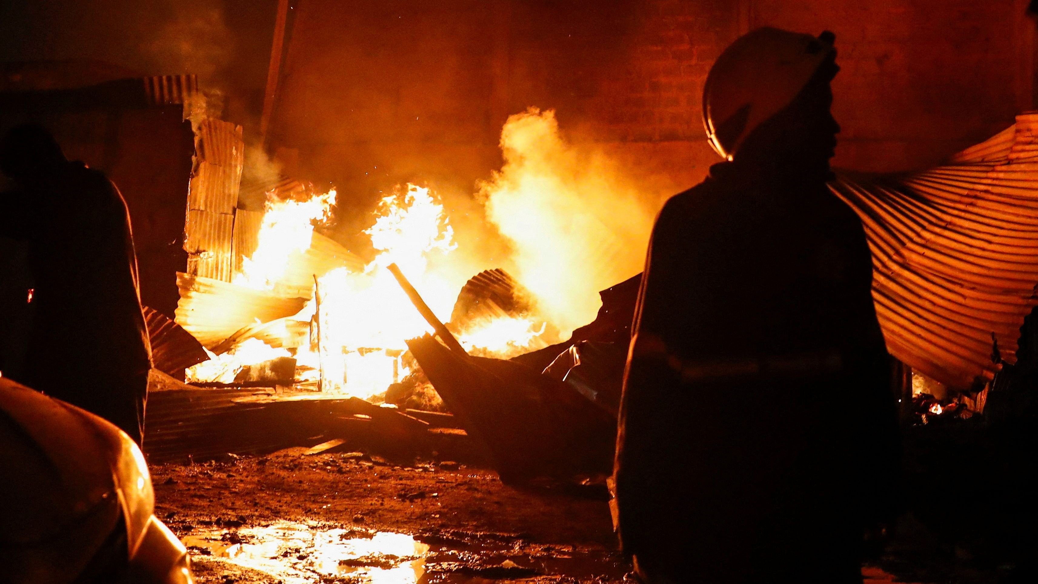 <div class="paragraphs"><p>A firefighter gathers at the scene of an explosion at a makeshift gas cylinder refilling depot in  Nairobi.</p></div>