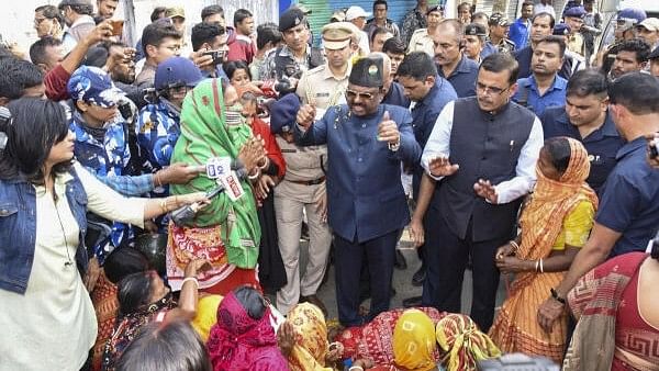 <div class="paragraphs"><p>West Bengal Governor CV Ananda Bose interacts with women protestors at Sandeshkhali block, in North 24 Parganas district, Monday, Febraury 12, 2024.</p></div>