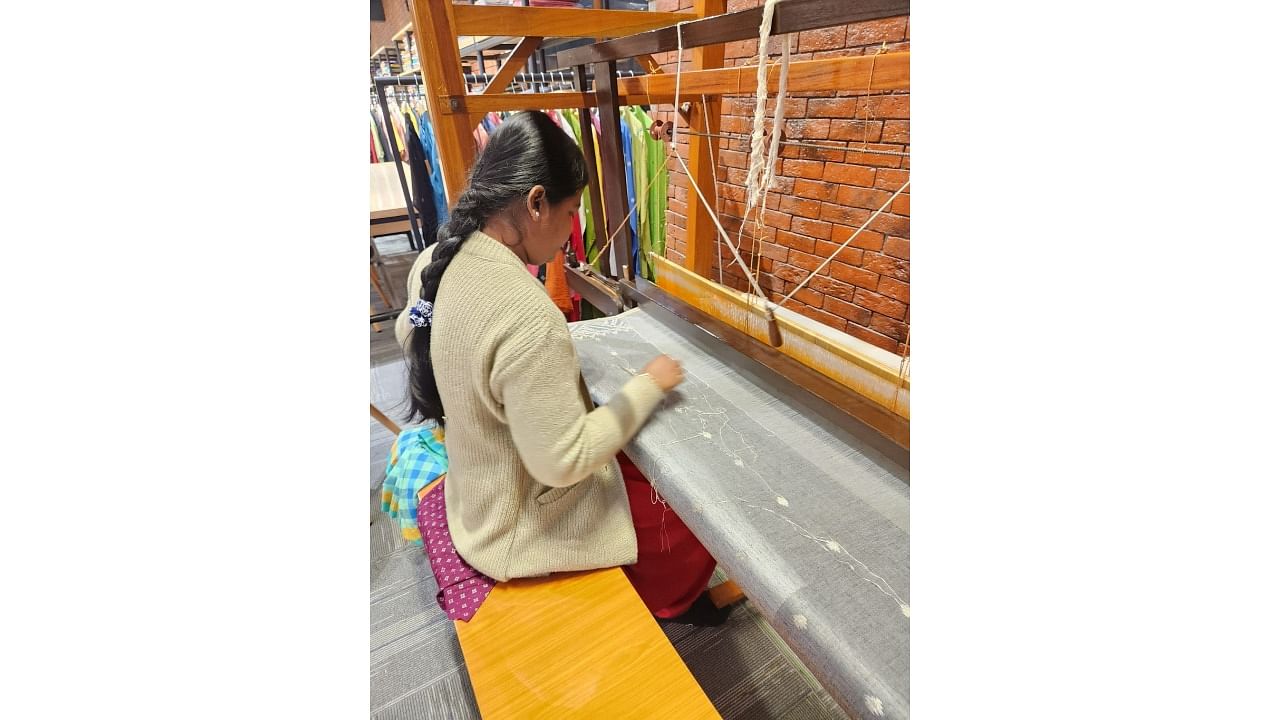 <div class="paragraphs"><p>A weaver working on a Tangail sari at a handloom. She is one of 7,000 weavers employed with weaver-cum-entrepreneur Biren Kumar Basak.&nbsp;</p></div>