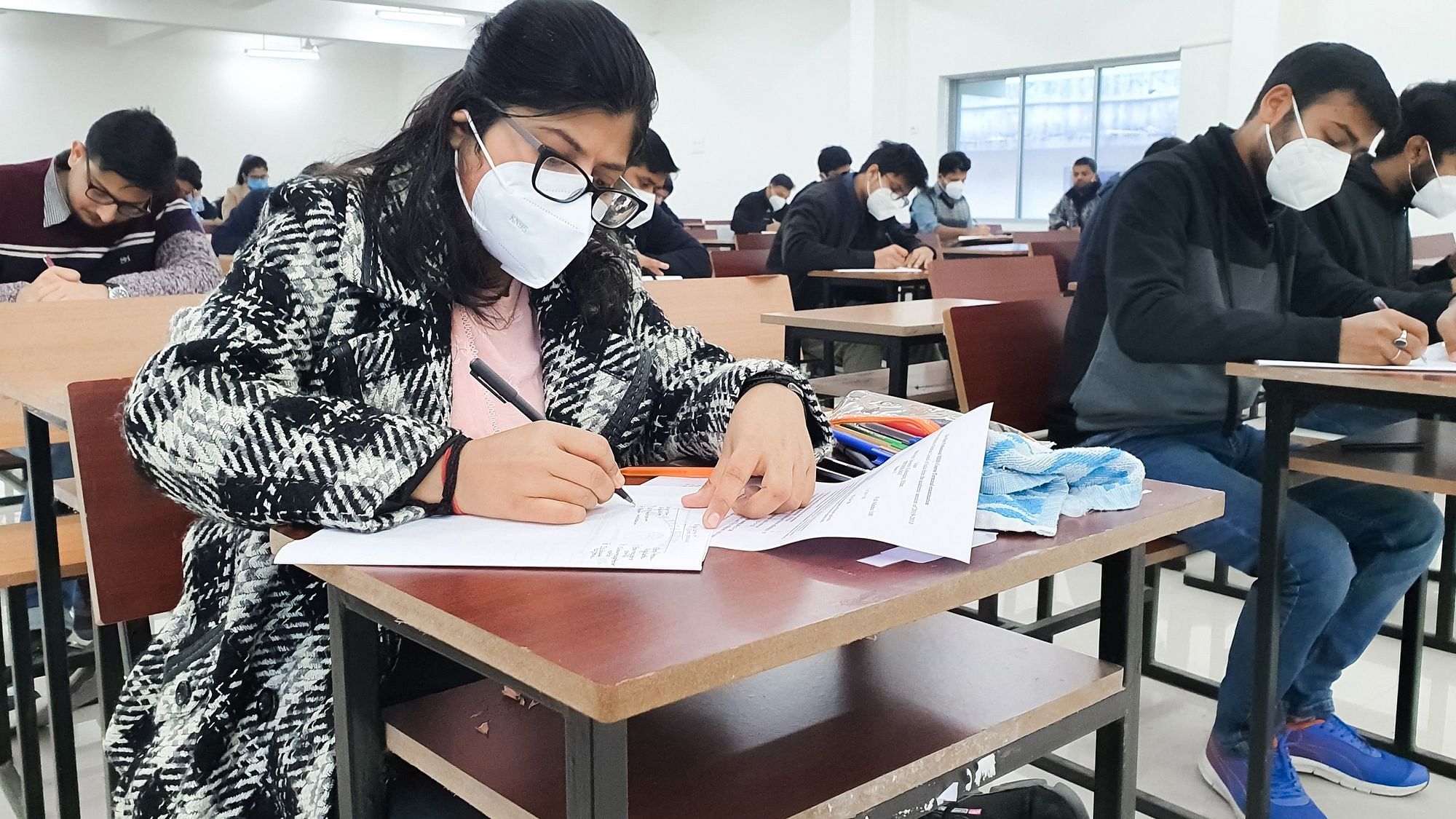 <div class="paragraphs"><p> Medical students writing examination paper in mask maintaining social distancing at Radheshwam Medical College, Lucknow, UP, India.</p></div>