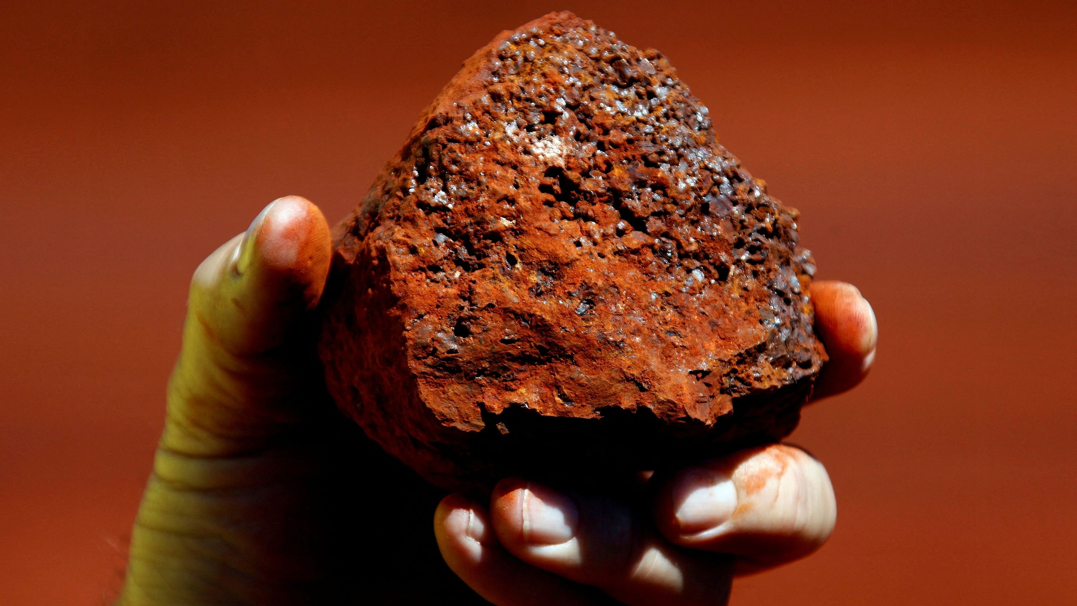 <div class="paragraphs"><p>A miner holds a lump of iron ore. Representative image.</p></div>