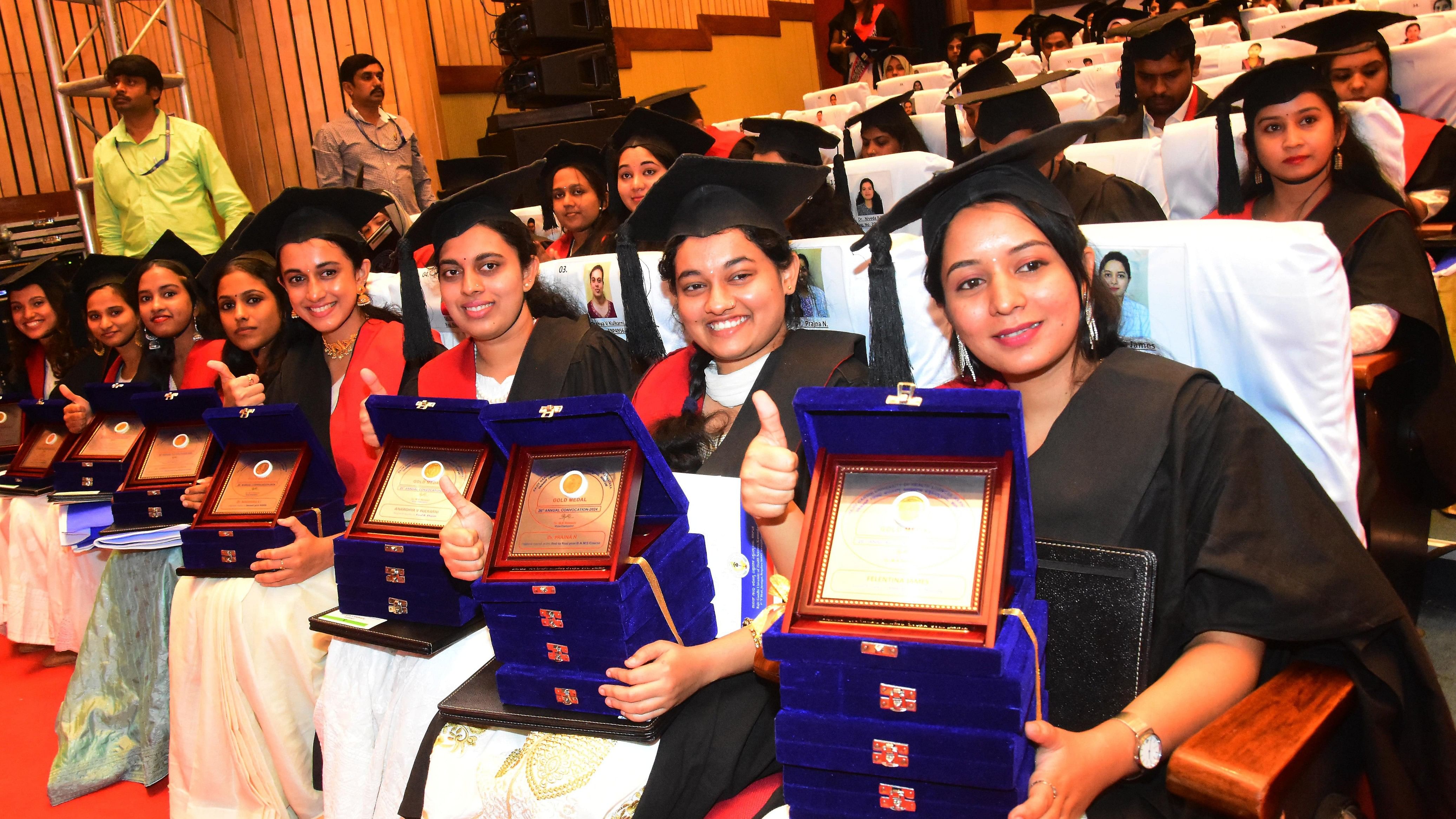 Gold medalists pose for a photo at Rajiv Gandhi University of Health Sciences on its 26th Annual Convocation in Bengaluru on Tuesday. DH PHOTO