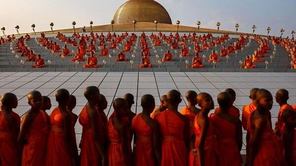 <div class="paragraphs"><p>Buddhist monks pray at the Wat Phra Dhammakaya temple during a ceremony commemorating Makha Bucha Day in Pathum Thani province outside Bangkok, Thailand, February 24, 2024.</p></div>