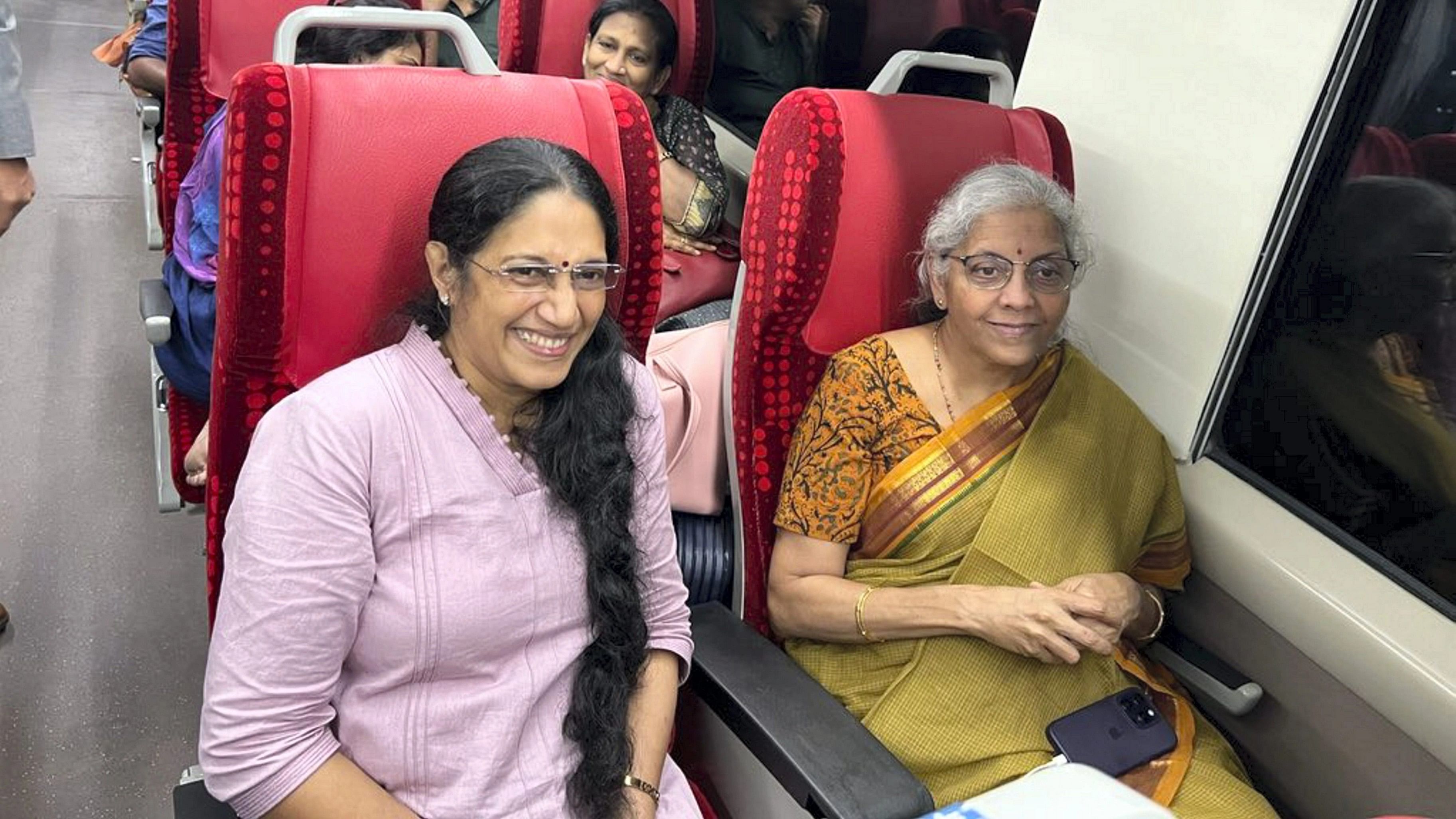 <div class="paragraphs"><p>Union Finance Minister Nirmala Sitharaman with a passenger in Vande Bharat Express train.</p></div>