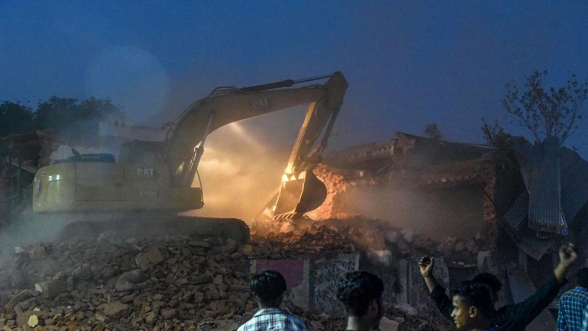 <div class="paragraphs"><p>Representative image of a bulldozer razing a building.</p></div>