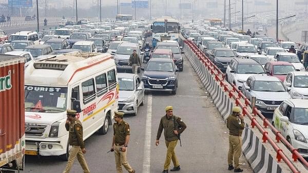 <div class="paragraphs"><p>Vehicles stuck in a traffic jam at Ghazipur border amid restrictions in vehicular traffic in view of farmers' 'Delhi Chalo' march.</p></div>