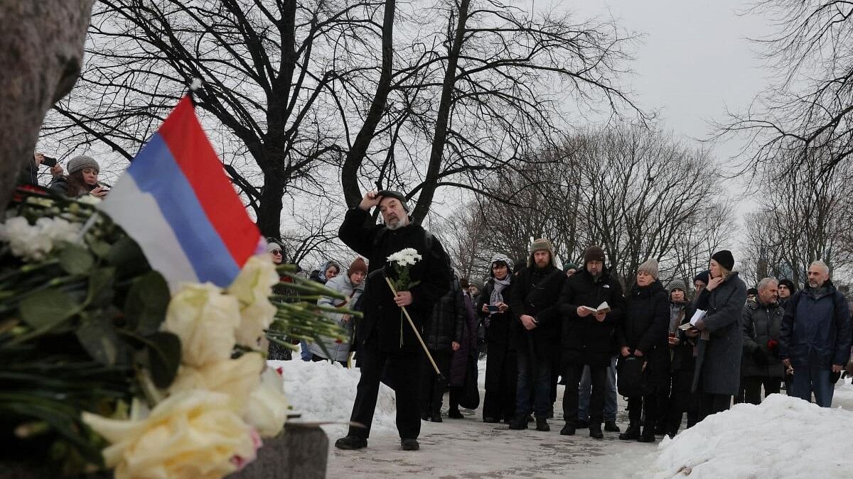 <div class="paragraphs"><p>People gather at the Solovetsky Stone monument to the victims of political repressions to honour the memory of Russian opposition leader Alexei Navalny, in Saint Petersburg, Russia.</p></div>