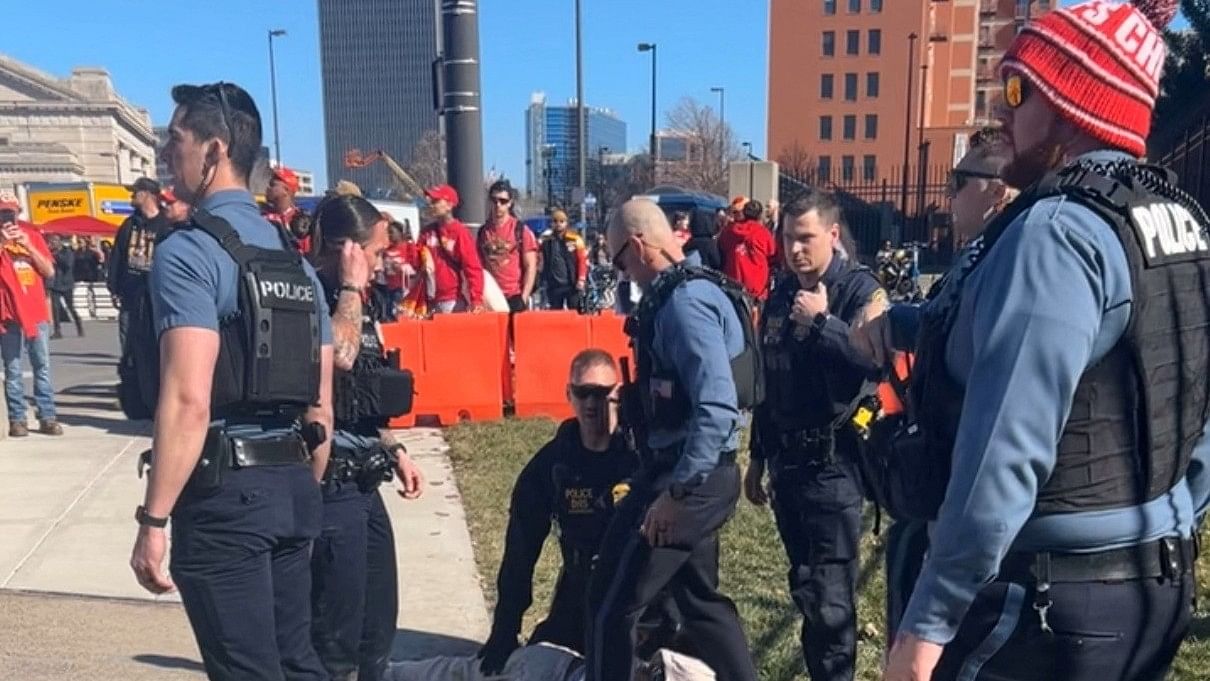 <div class="paragraphs"><p>Police officers detain a person outside of Union Station following a shooting near an outdoor celebration of the NFL champion Chiefs' Super Bowl victory, in Kansas City, Missouri, U.S. February 14, 2024.</p></div>