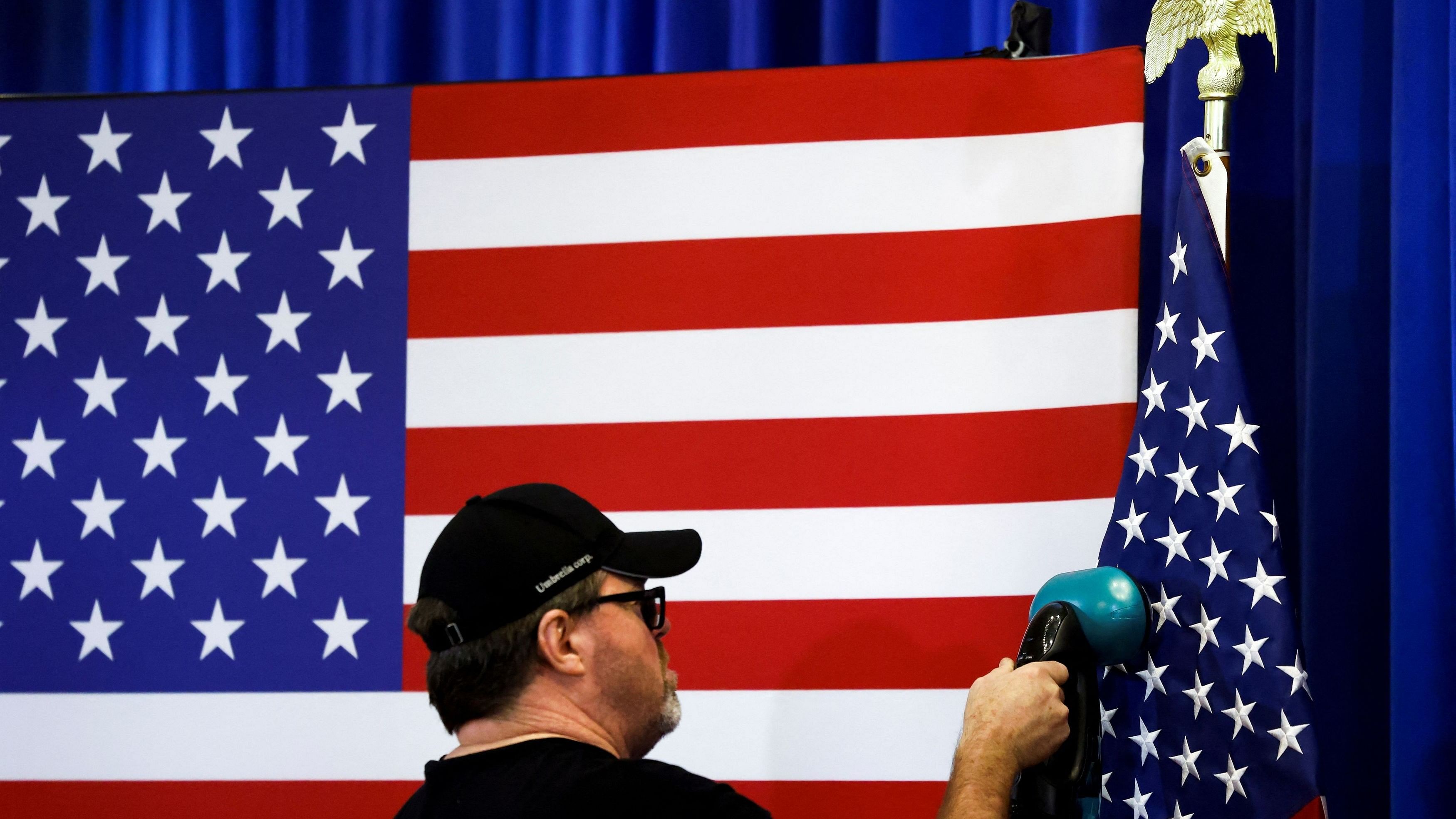 <div class="paragraphs"><p>A man steams an American flag before a campaign stop for Republican presidential candidate and former US Ambassador to the United Nations Nikki Haley in Laurens, South Carolina, US, February 12, 2024. </p></div>