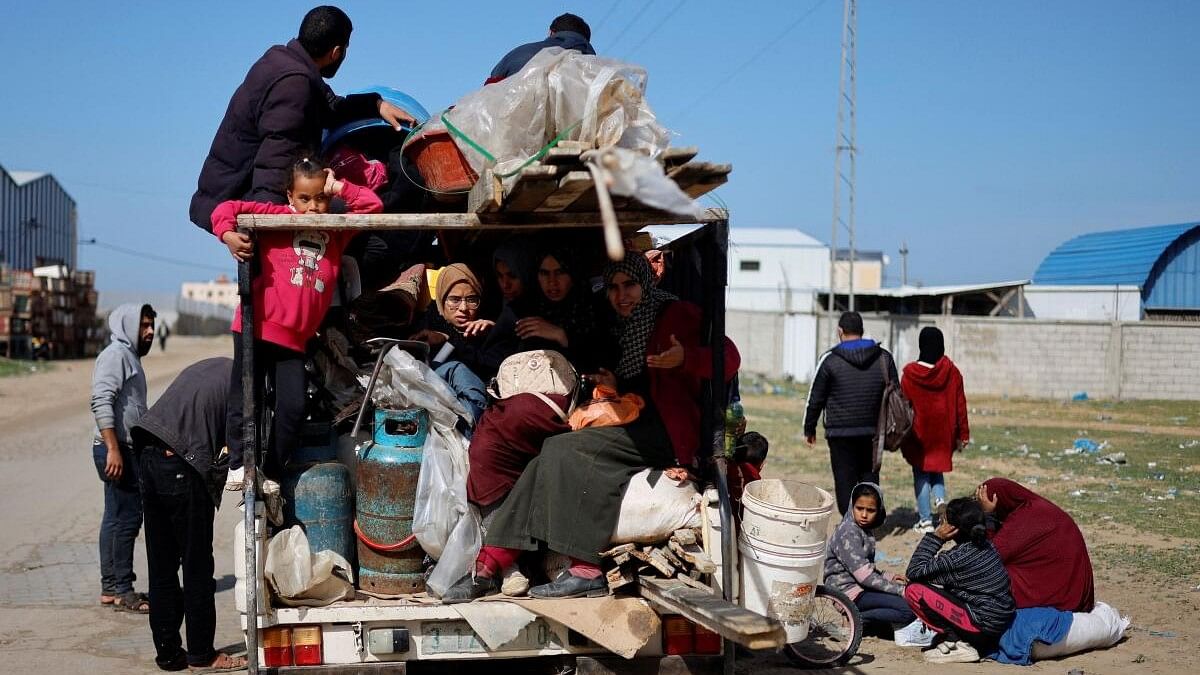 <div class="paragraphs"><p>Palestinian arrive in Rafah after they were evacuated from Nasser hospital in Khan Younis due to the Israeli ground operation, amid the ongoing conflict between Israel and Hamas, in the southern Gaza Strip.</p></div>