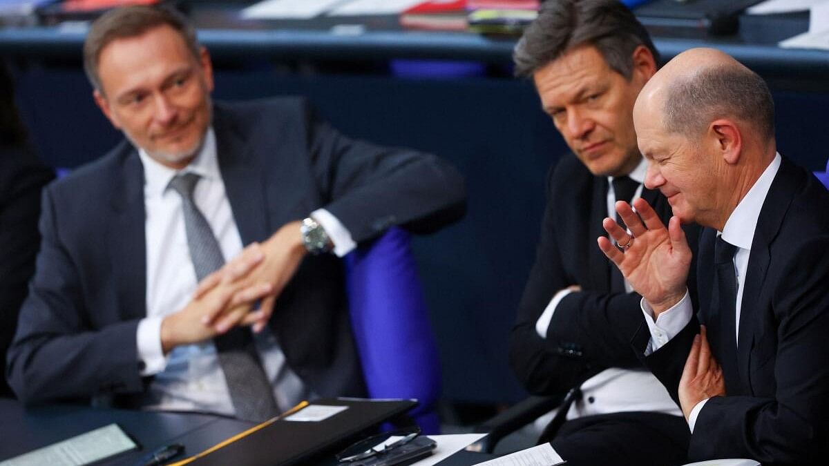 <div class="paragraphs"><p>German Finance Minister Christian Lindner, Economic Affairs and Climate Action Minister Robert Habeck and Chancellor Olaf Scholz attend the 2024 budget debate session of the German lower house of parliament, the Bundestag, in Berlin.</p></div>