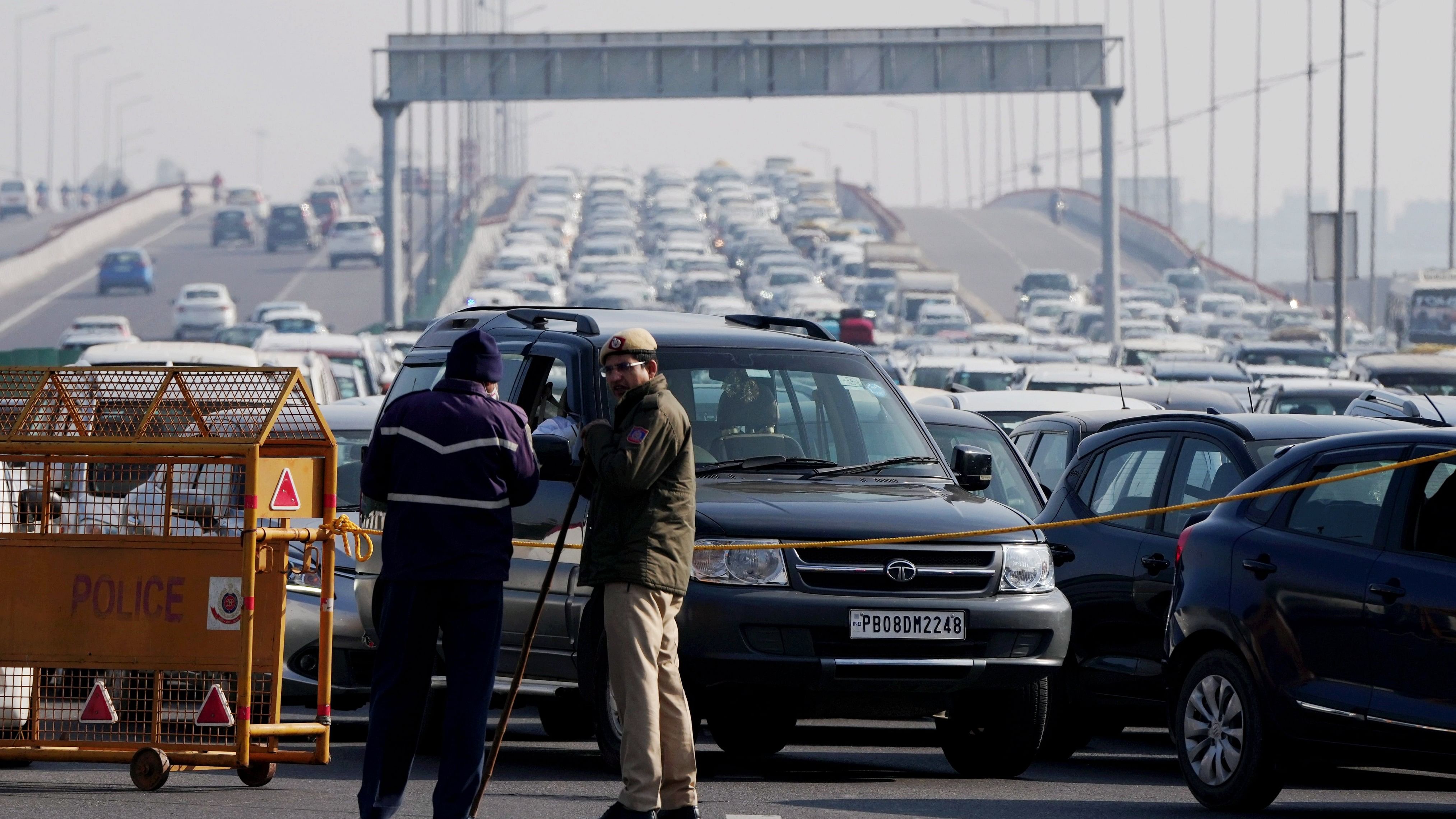 <div class="paragraphs"><p>Vehicles stuck in a traffic jam at NH 24 due to a road closure ahead of farmers’ protest.</p></div>