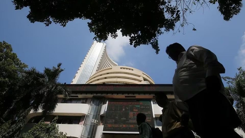 <div class="paragraphs"><p>A man walks past the Bombay Stock Exchange (BSE) building in Mumbai.</p></div>