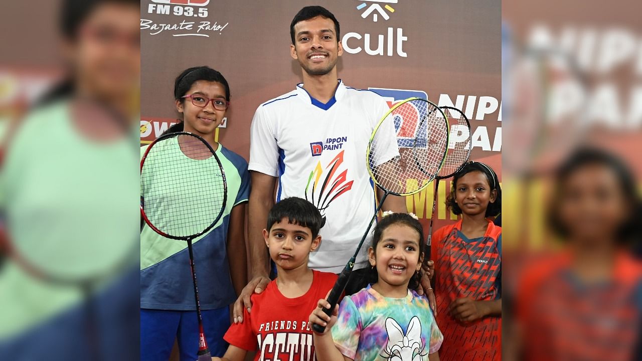 <div class="paragraphs"><p>One half of India's World No. 1 doubles pair, Chirag Shetty, poses with young badminton players during a promotional event in Bengaluru on Saturday. </p></div>