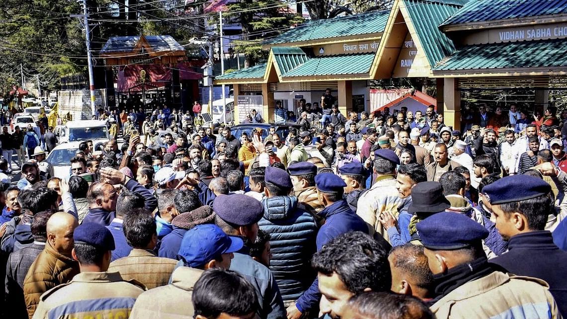 <div class="paragraphs"><p>Security personnel deployed to maintain law &amp; order after Congress and BJP workers gathered outside the Himachal Pradesh Legislative Assembly, in Shimla, Wednesday, February 28, 2024.</p></div>