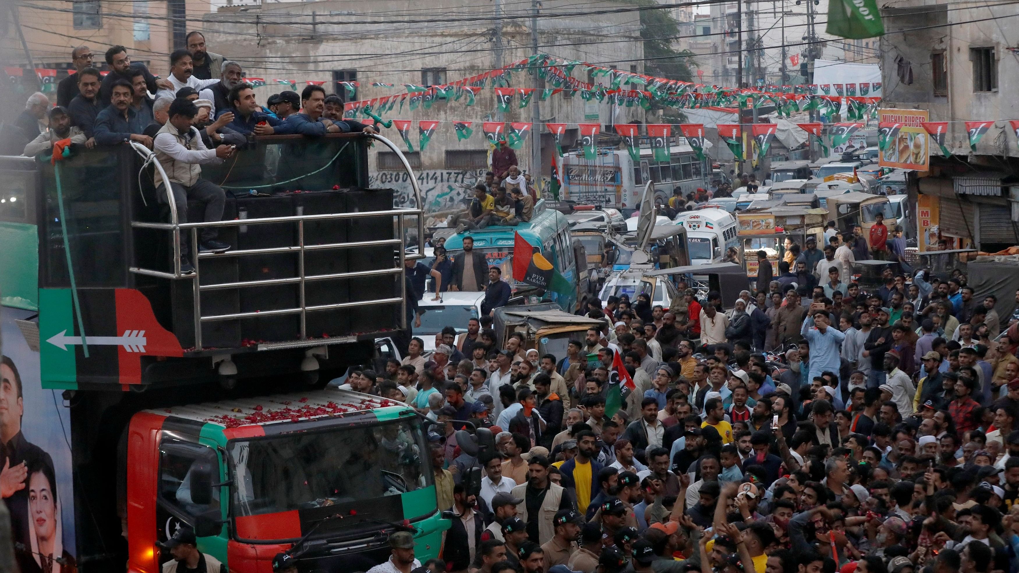 <div class="paragraphs"><p>Supporters of Bilawal Bhutto Zardari, Chairman of the Pakistan Peoples Party (PPP), gather around his vehicle during an election campaign rally, ahead of the general elections, in Karachi.</p></div>