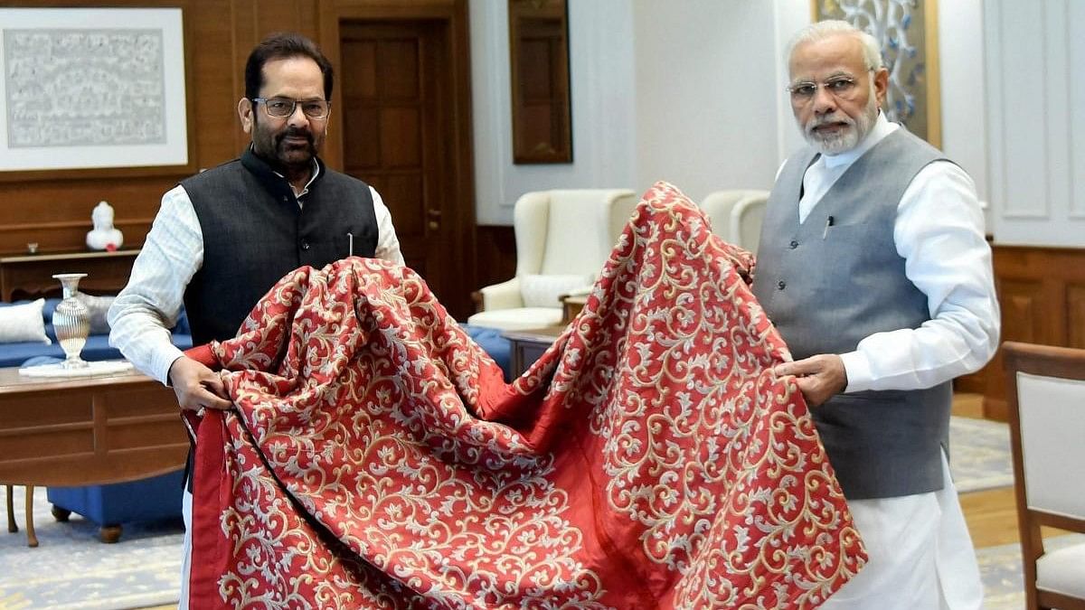 <div class="paragraphs"><p>File photo of PM  Narendra Modi handing a  chaadar to be offered at Dargah Ajmer Sharif to BJP leader Mukhtar Abbas Naqvi.&nbsp;</p></div>