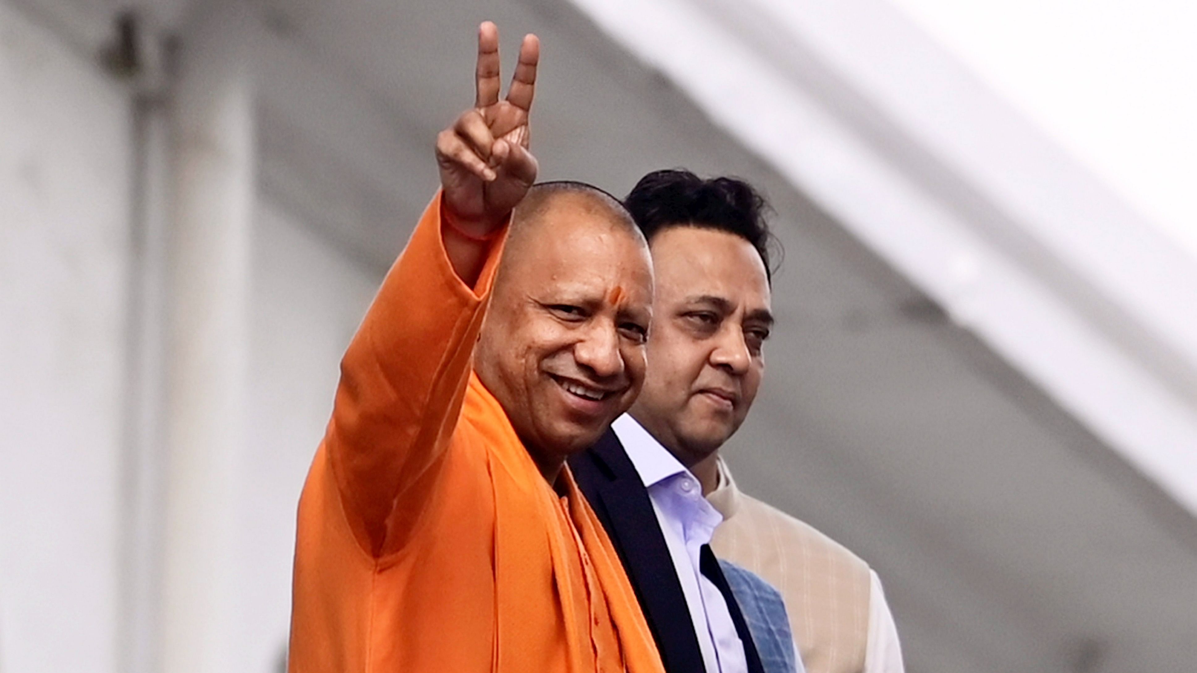 <div class="paragraphs"><p>Uttar Pradesh Chief Minister Yogi Adityanath leaves after casting his vote for the Rajya Sabha election, in Lucknow, on Tuesday</p></div>