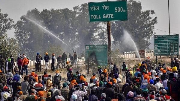 <div class="paragraphs"><p>Police use tear gas shells to disperse farmers gathered at the Punjab-Haryana Shambhu border during the second day of their 'Delhi Chalo' march, near Patiala, Wednesday, Feb. 14, 2024.</p></div>